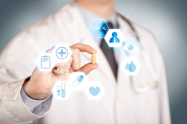 istock A doctor in white holding a pill 961182536