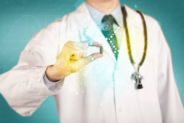 istock A doctor in tie holding a pill 961182684