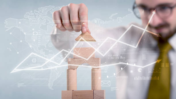 istock Businessman building a tower 961195772