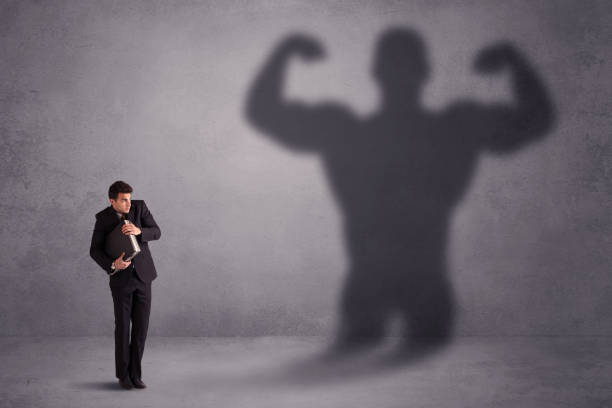 istock Business man looking at his own strong fit shadow concept 961201752