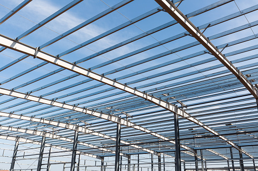 steel structure workshop closeup against a blue sky