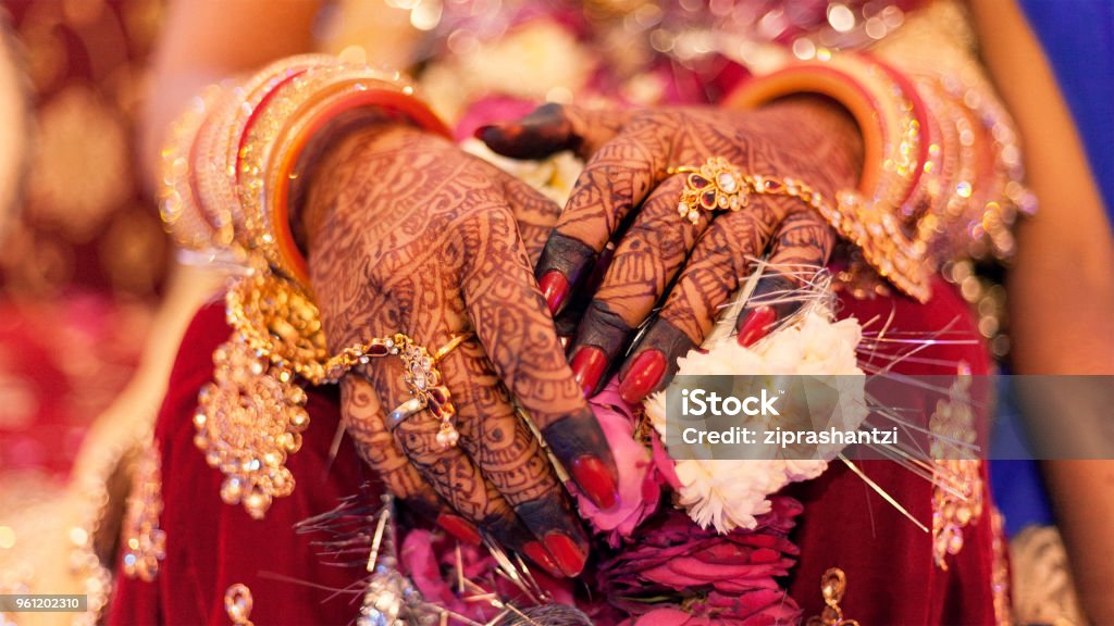 Hands Of An Indian Bride Tattooed With Natural And Local Dye Mehndi Or  Henna During A Hindu Wedding Ceremony Stock Photo - Download Image Now -  iStock
