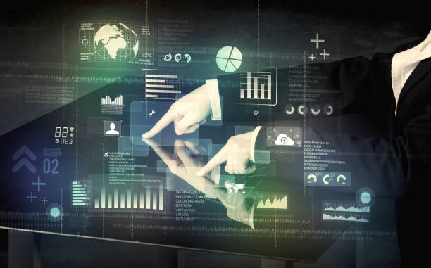 istock Businessman touching interactive modern desk with technology icons 961202836