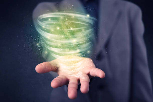 istock Businessman holding green tornado 961207442