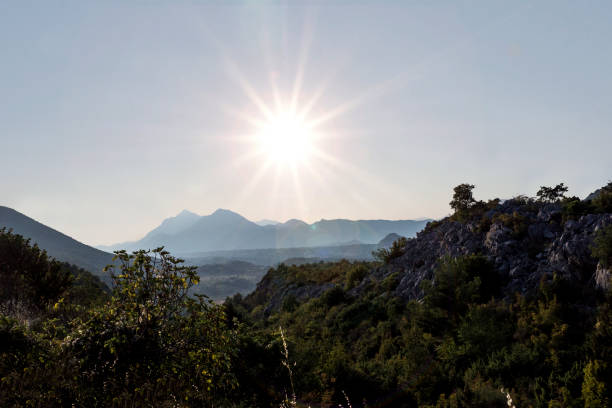 istock Mountainous Landscape with Bright Glowing Sun 961210968