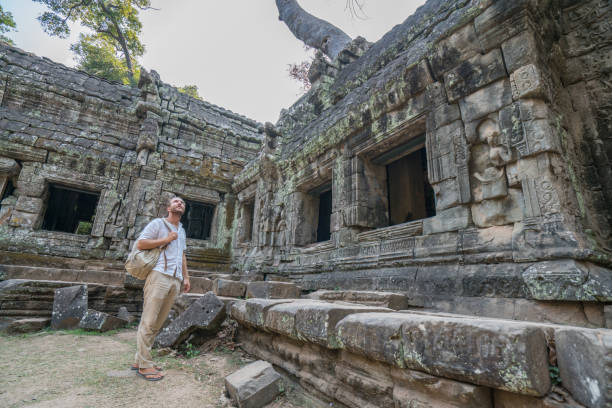 istock Male tourist visiting ancient temple in Asia 961215616