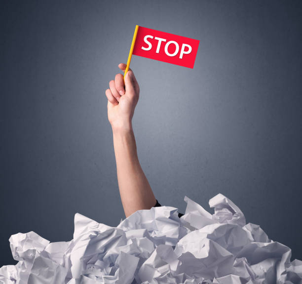 istock Female hand holding stop sign 961215802