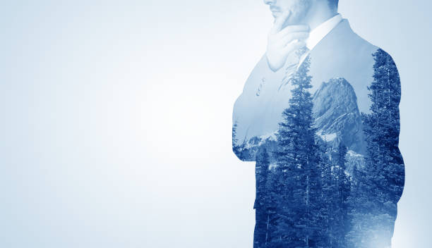 istock Businessman standing with mountain 961219360