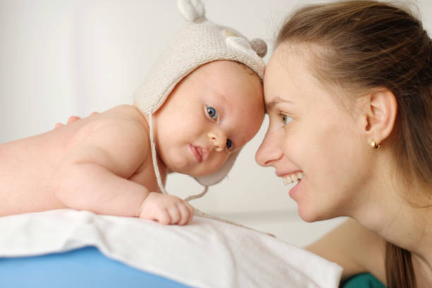 istock Two months old newborn baby with mother 961222630