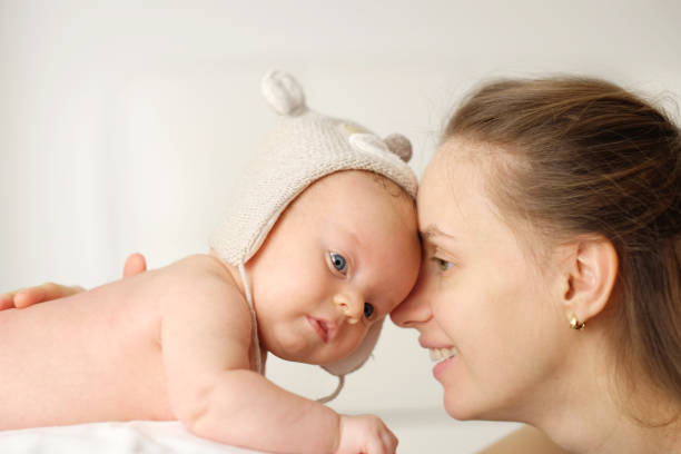 istock Two months old newborn baby with mother 961222632