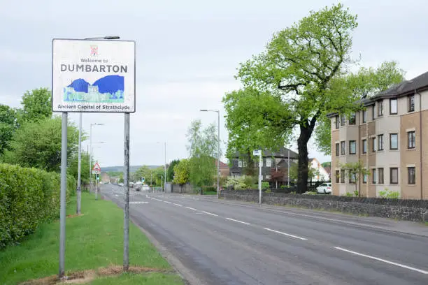 Welcome to Dumbarton sign greeting rural village town entrance road post countryside Dunbartonshire Scotland uk
