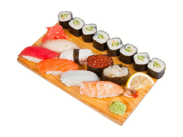 istock Sushi and roll set on wooden board with gari and lemon 961232042