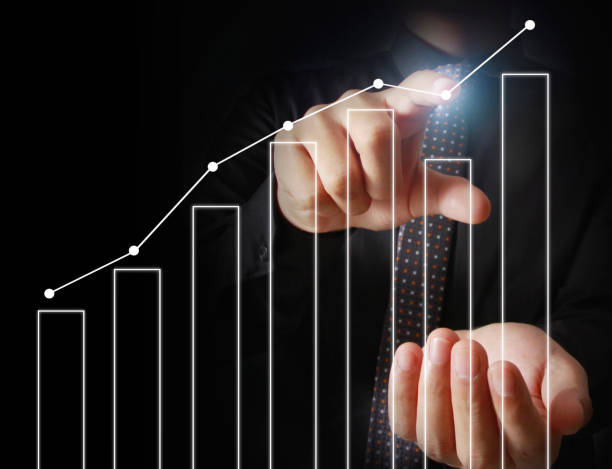 istock Businessman with financial symbols coming 961233086