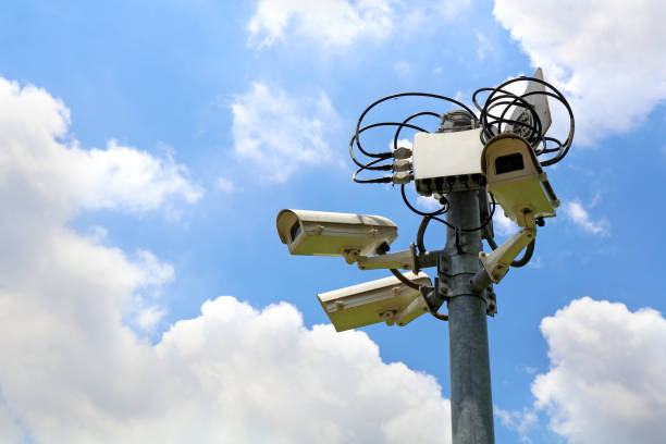 istock cctv security camera with record controller box on blue sky background, eye of sky 961239928