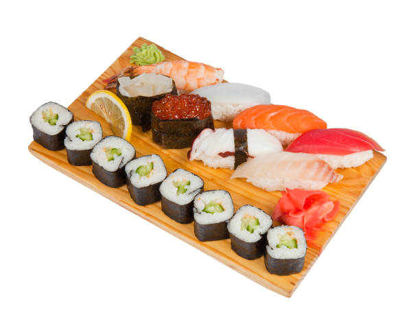 istock Sushi and roll set on wooden board with gari and lemon 961248038
