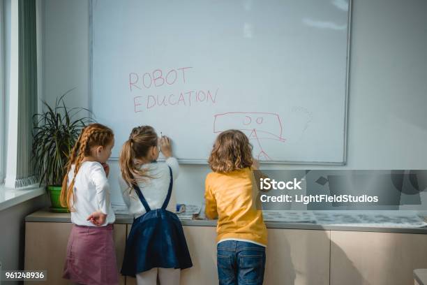 Children Writing And Drawing On Whiteboard Stock Photo - Download Image Now - Elementary Student, 6-7 Years, Art