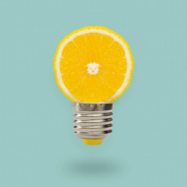 istock Lemon light bulb on bright blue background. Summer fun concept. 961249630