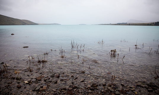 Dramatic aquatic landscape of New Zealand's most iconic blue lake.