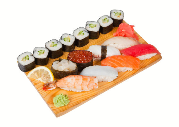 istock Sushi and roll set on wooden board with gari and lemon 961255150
