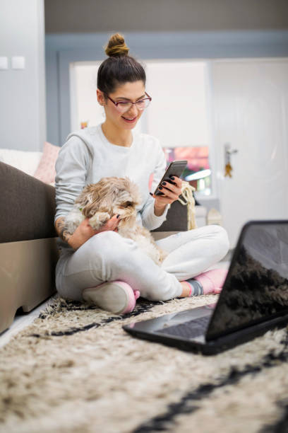 istock Young woman with cute dog 961255668