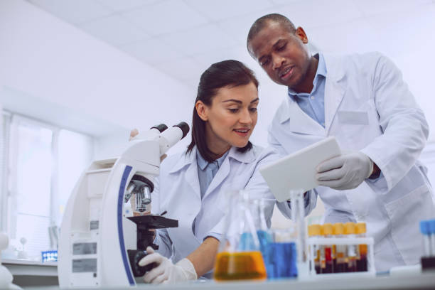 istock Inspired researcher discussing work with her colleague 961256372