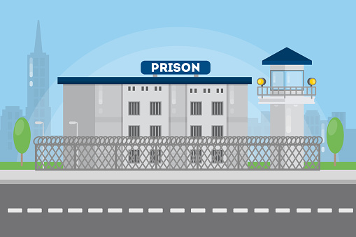 Prison city building in urban landscape with bars and tower.