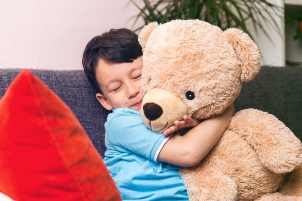 istock Cute child and teddy bear 961264568