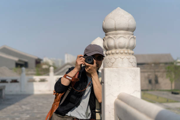 istock male photographer shooting old Chinese architecture 961265162