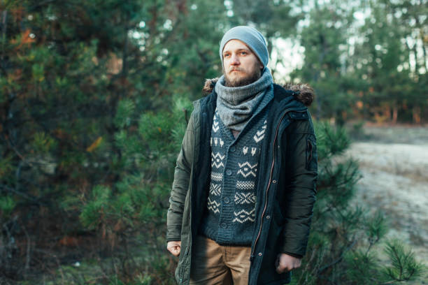 istock Portrait brutal bearded hipster man in the forest 961269934