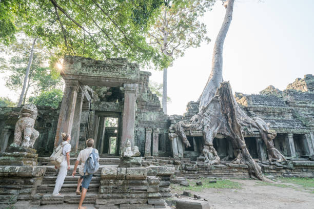 istock Young couple contemplating ancient temple in Cambodia 961271230