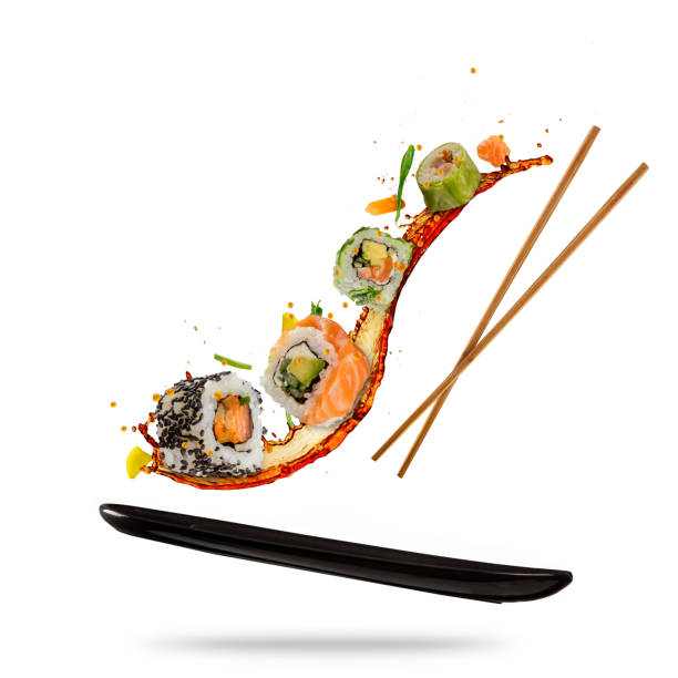 flying sushi pieces on white background - susi imagens e fotografias de stock