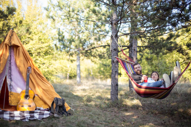 istock Romantic hipster couple enjoy rest on a hammock 961284934