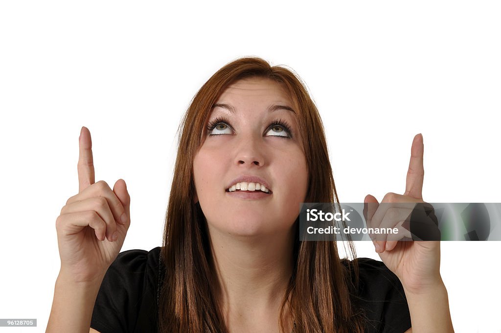 Product Placement: Pretty Young Woman Looking Up & Pointing  18-19 Years Stock Photo