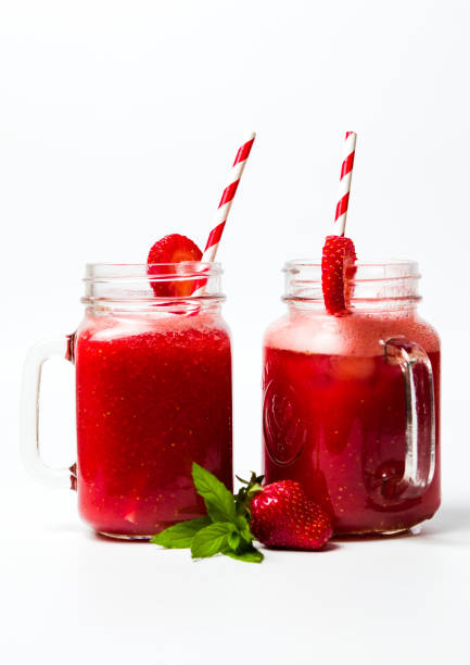 istock Strawberry smoothie in the jar isolated 961292672