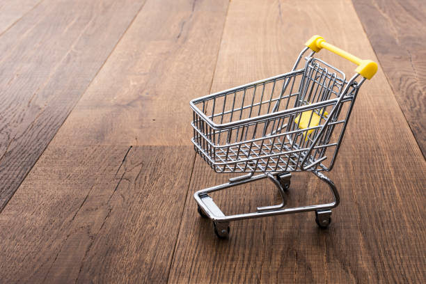 istock Miniature shopping cart on a desk 961300550