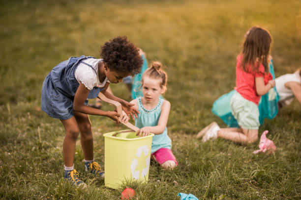 istock Children doing environmental cleanup during spring day at the park. 961307784