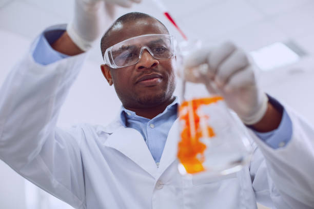 istock Experienced biologist working with tubes in the lab 961308846