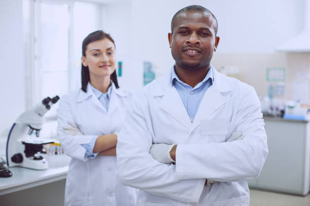 istock Cheerful biologists standing in the lab 961310204
