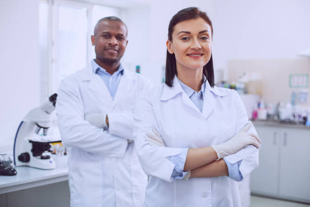 istock Joyful biologists standing in the lab 961310216