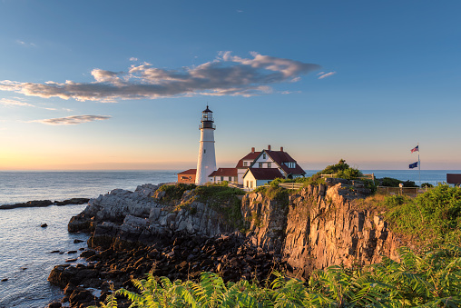 Sunrise at Portland Head Lighthouse in Cape Elizabeth, New England, Maine, USA.  One Of The Most Iconic And Beautiful Lighthouses.