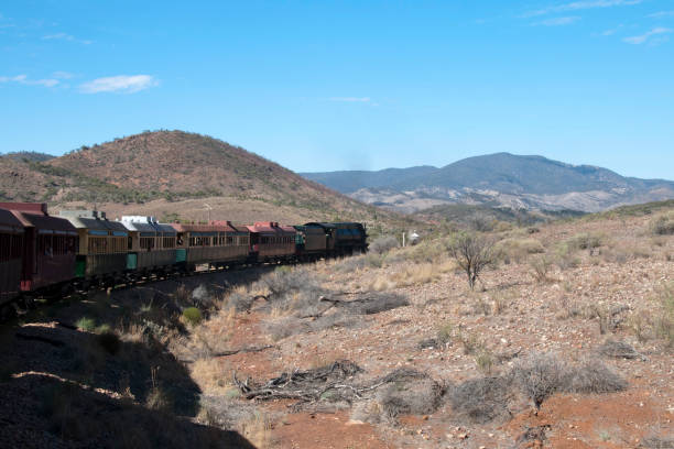 istock Vintage steam train travelling through semi arid landscape 961325528