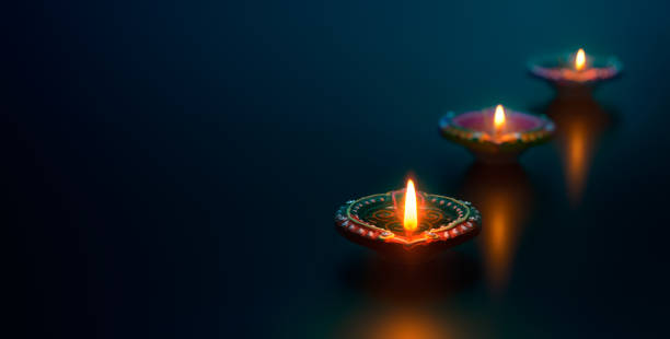 istock Diya lamps lit during celebration 961336486