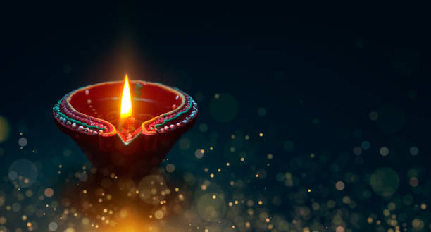 istock Diya lamp with magical particle 961336488