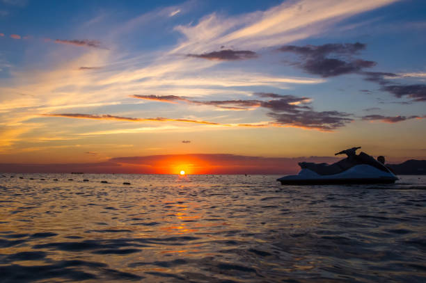 istock silhouette of a jet ski in the sun 961340868