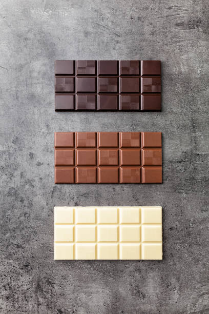 istock Delicious variety of chocole on rustic background 961344056