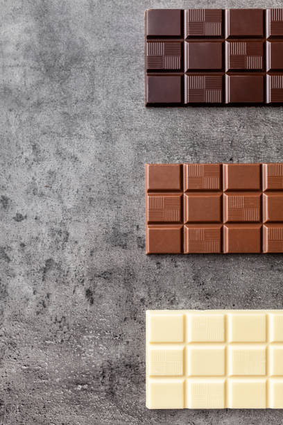 istock Delicious variety of chocole on rustic background 961344618