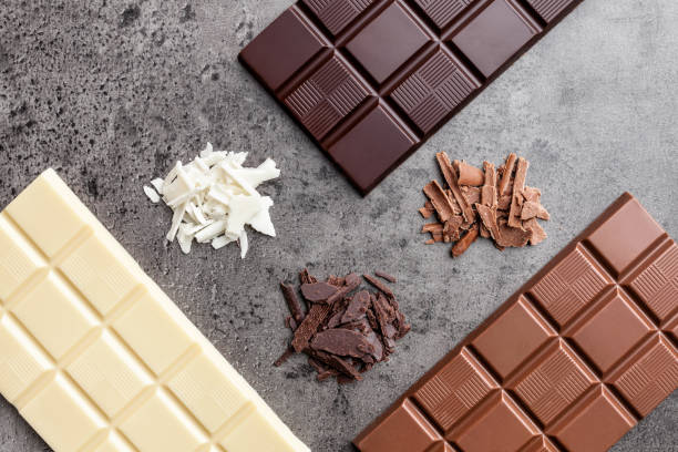 istock Delicious variety of chocole on rustic background 961344722
