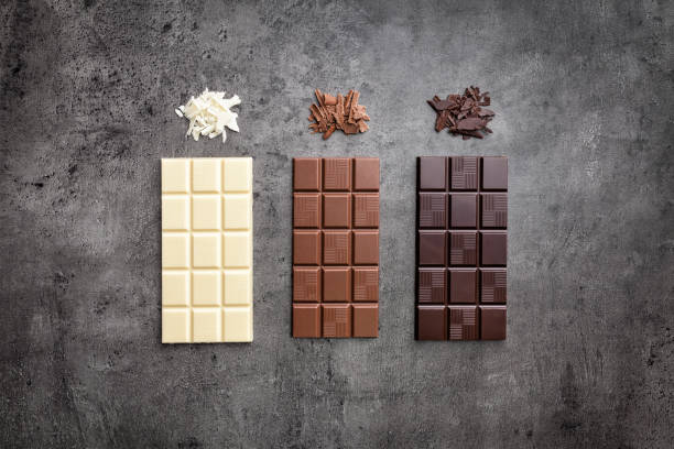 istock Delicious variety of chocole on rustic background 961345200