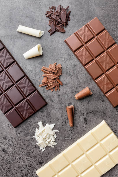 istock Delicious variety of chocole on rustic background 961345398