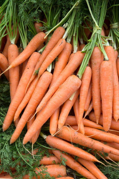istock Carrot Background on Market 961350050
